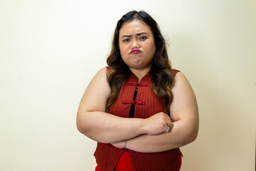 Frustrated Woman Pouting with Arms Crossed, Displeased Expression