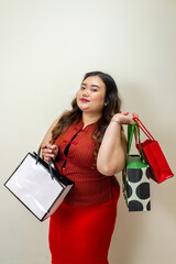 Plus Size Woman Smiling Holding Shopping Bags - Retail Therapy, Fashion, and Gifts