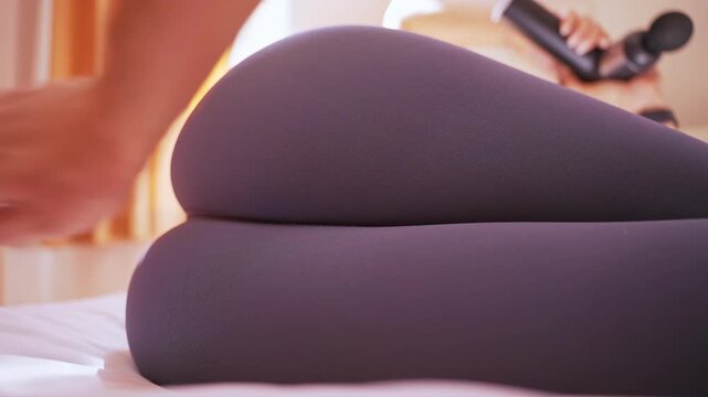 Hand striking Woman Hip in tight leggings on bed with a close low angle showing slow motion. The concept of harassment and abuse or attention from men