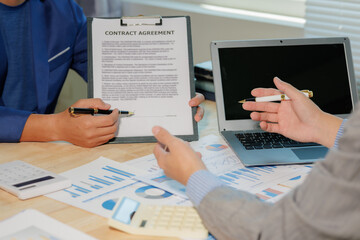 Corporate team discussing market data. Collaborative effort for business