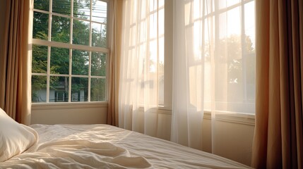 Fototapeta premium Soft Morning Light Streaming Through Sheer Curtains in a Bedroom