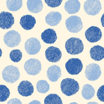 Hand drawn blue sketch polka dots seamless pattern with pencil texture on light beige background