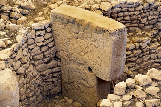 Gobekli Tepe neolithic archaeological site dating from 10 millennium BC, Massive stone pillars with sculptural relief of wild animals, Potbelly Hill, Sanliurfa, Turkey