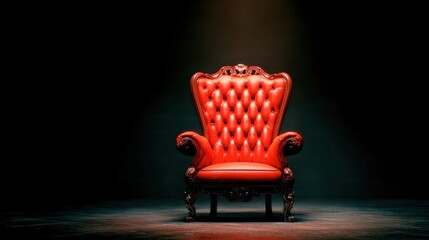 Fototapeta premium Red chair stands alone in dark space with spotlight at evening time