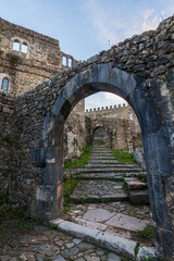 Fototapeta premium A low-angle view through a weathered stone archway