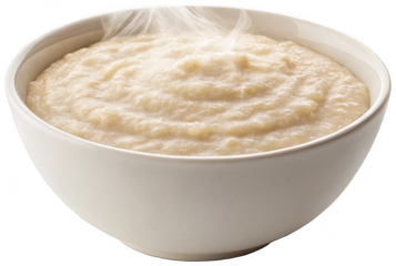 Steaming, creamy, beige-colored mashed potatoes are generously filled within a smooth, rounded, white ceramic bowl, exhibiting wisps of vapor rising from the, isolated on transparent background.