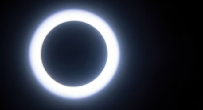 Dramatic theatrical stage lighting background with a powerful bright white circular beam effect on a dark background, intense, lamp, display