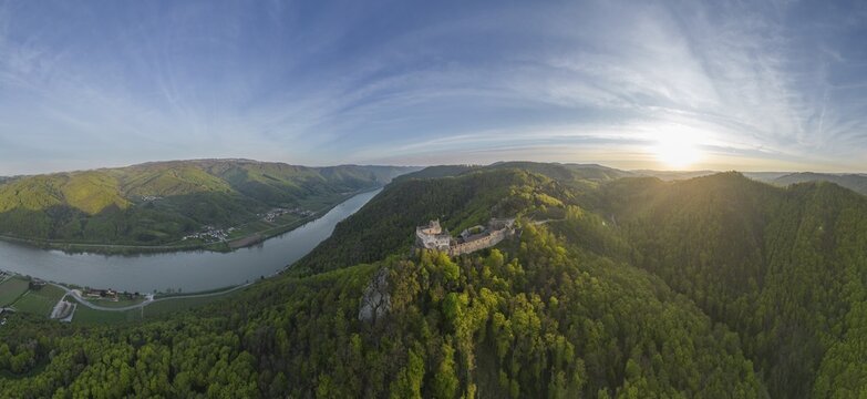 Drone shot of Aggstein Ruin at sunrise with Danube, Wachau, Sch&ouml;nb&uuml;hel-Aggsbach, Lower Austria, Austria