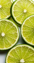 A close up view of several freshly cut bright green lime slices showcasing the juicy pulp, vibrant texture, and natural refreshing quality, bright, green, texture