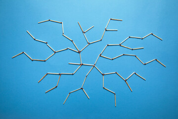 Global network connection made by match on the blue background.