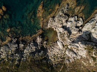 Fototapeta premium Aerial View of Rocky Coastline and Clear Waters