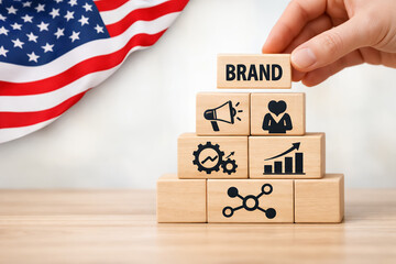 American Brand Building Strategy Concept with Wooden Blocks and United States Flag Background for Marketing and Business Identity