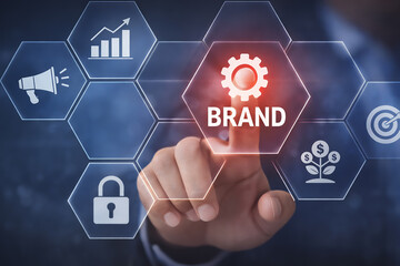 Digital brand strategy and ecosystem concept with hand touching a glowing branding interface icon