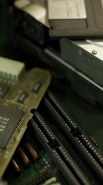 stacked memory modules in motherboard slots with gold pins and connectors, technician maintenance scene during upgrade, focused shallow depth, data center