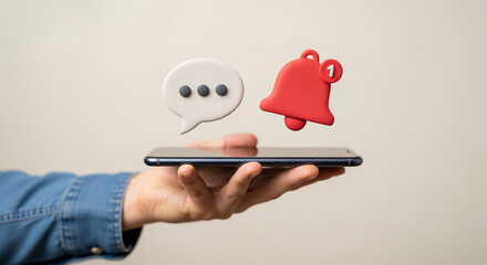 Hand holding smartphone displaying notification and message icons, symbolizing digital communication and alerts