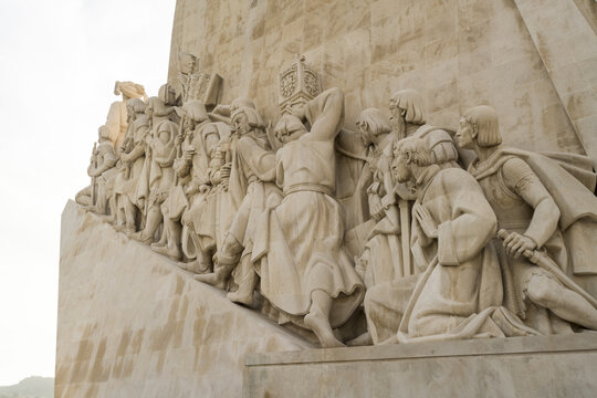 View of the intricate stone carvings depicting historical figures and maritime themes at the Monument to the Discoveries, its pale hue contrasting with the sky, Lisbon, Lisbon, Portugal.