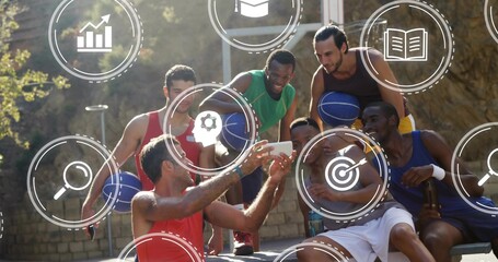 Taking selfie, six men at court holding phone and blue basketballs, wearing tanks, icons overlaying