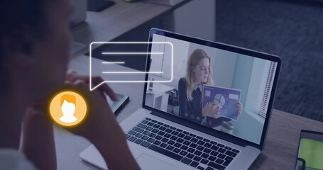 Displaying laptop showing presenter wearing dark blazer holding purple chart at desk, chat bubble