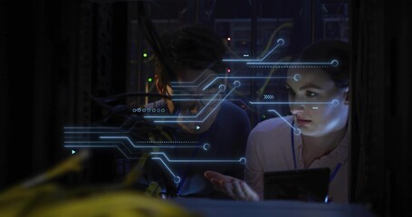 Troubleshooting techs examining racks in rack bay, woman in light shirt, yellow cables and holo UI