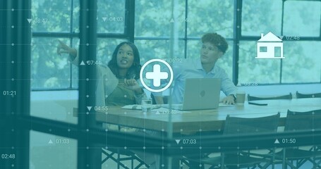 Pointing woman and watching man wearing blazers, leaning toward screen in meeting room with laptop