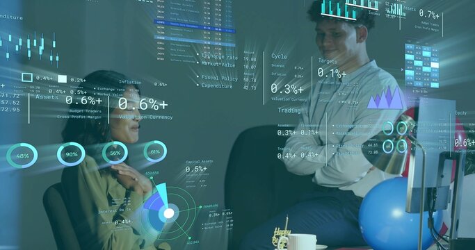 Discussing coworkers in business casual analyzing financial data overlays in office nook with cake - Powered by Adobe