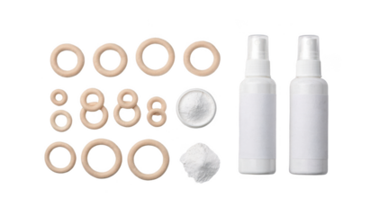 Flat lay composition of medical barrier rings powder and spray arranged neatly on white surface showcasing essential supplies for peristomal skin barrier application.