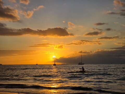 Sunset Over the Ocean with the Silhouette of a Kayaker