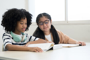 Student and library with books. Students read books in library room at school. Students of diverse nationalities in library. Learning or university education