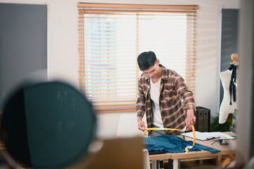 Fashion designer working in his home studio