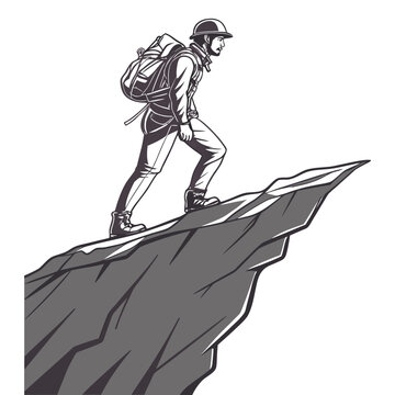 Man in hiking gear standing on sharp mountain rock ledge