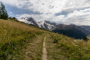 Mountain landscape in the Arves Massif, French Alps, with the iconic La Meije peak in the...