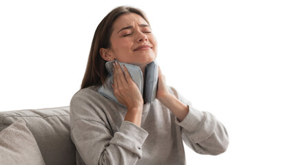 Person applying reusable cold gel pack to neck while sitting upright in a bright cozy home setting with soft natural light.