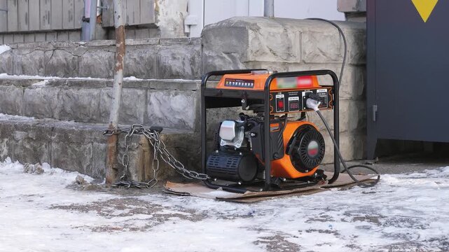 A gasoline generator during a winter blackout in Kyiv on the street