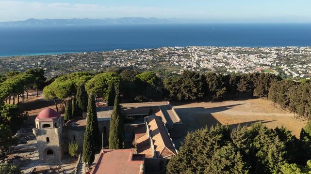 Aerial exploration of Filerimos Monastery revealing coastal views and Ancient Ialysos in Rhodes Greece