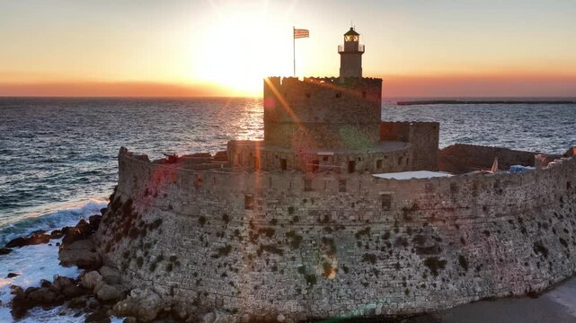 Saint nicholas fortress in rhodes greece at sunset beautiful aerial view of the ancient harbor