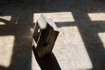 Sunlit aged crate, Abandoned space with textured wood and tiled floor