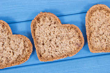 Bread in shape of heart baked from whole grain flour