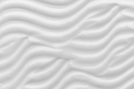 Cream texture with smooth wavy white surfaces
