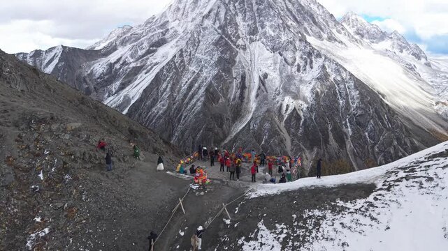Drone Reveal Shot of Yala Snow Mountain in Winter