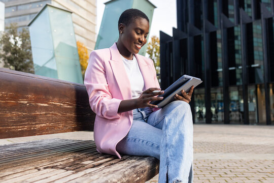 Confident african businesswoman using digital tablet