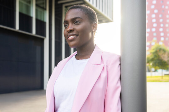 Confident businesswoman smiling outdoors