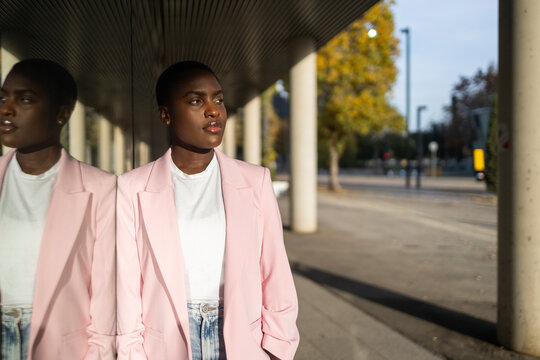 Confident business woman in pink blazer