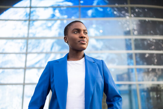 Confident african businesswoman standing outside