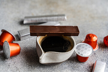 Espresso coffee with chocolate and capsules