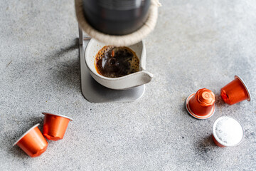 Brewing espresso with coffee capsules and machine