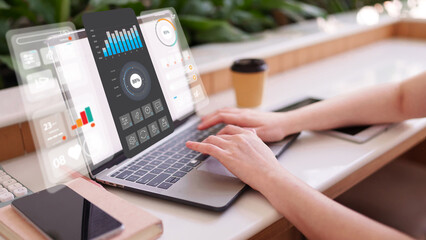 Professional using laptop with futuristic virtual dashboard to analyze data for business growth and market strategy data analysis business intelligence fintech