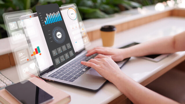 Professional using laptop with futuristic virtual dashboard to analyze data for business growth and market strategy data analysis business intelligence fintech - Powered by Adobe