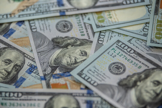 Hundred dollar banknotes spread symbol of wealth and finance