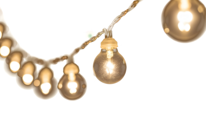 Golden string lights hang in a warm cozy atmosphere indoors