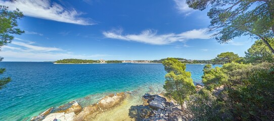 Panoramic Adriatic bay with islands and pine trees